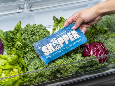 A skipper being placed onto a bed of fresh crisp vegetables in a crisper drawer
